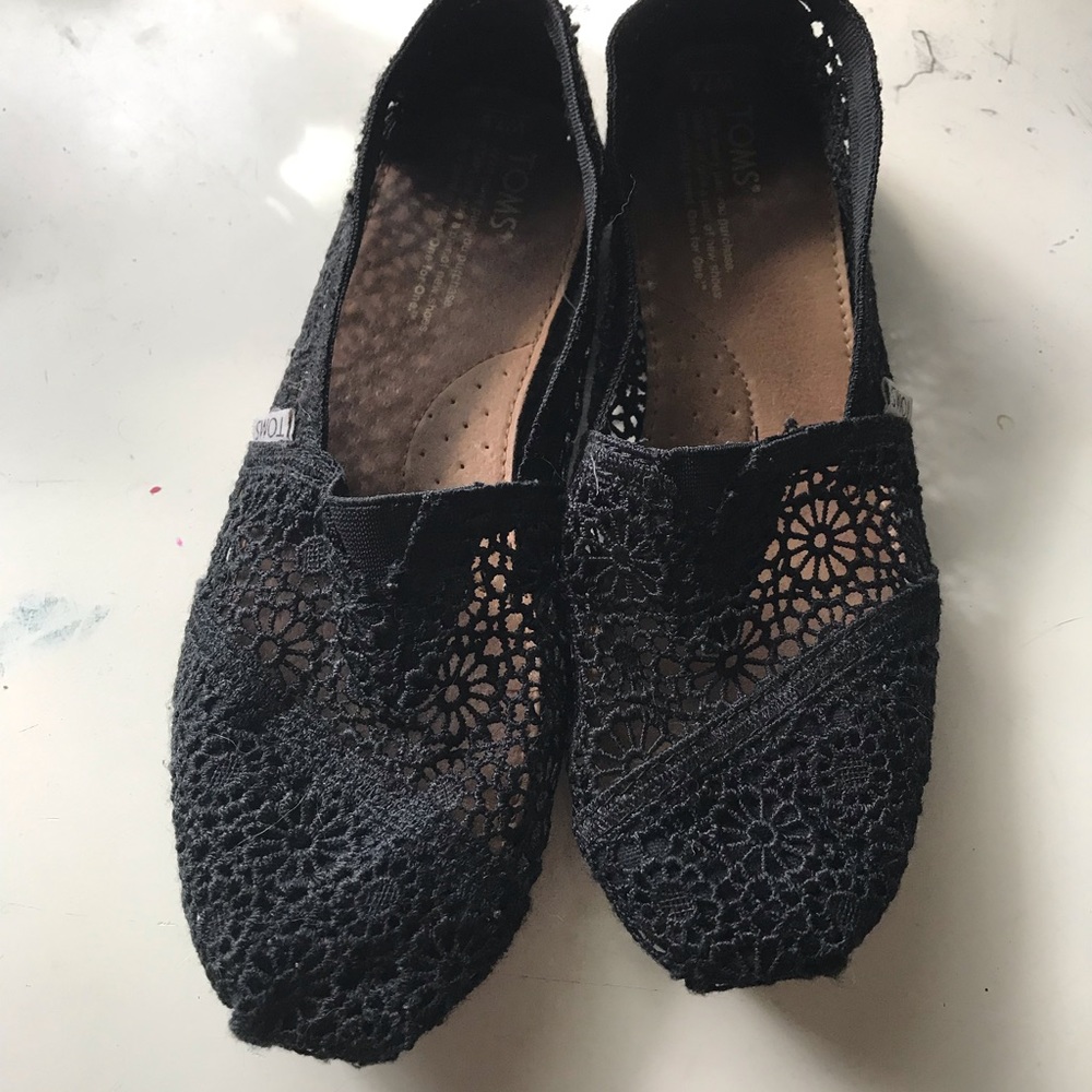 Black slip on Toms shoes